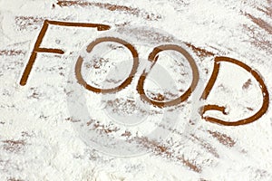 The inscription `Food` on flour. Background. Cooking food