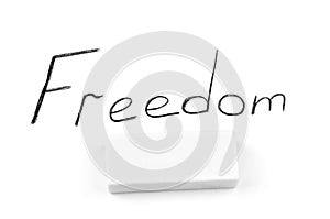 The inscription freedom isolated on a white background.Destruction of freedom
