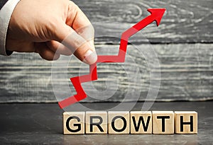 The Inscription Growth and up arrow. The concept of a successful business. Increase in income, salary. The growth of the company`