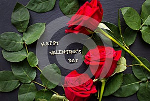 The inscription `Happy Valentine` on a black background with red roses