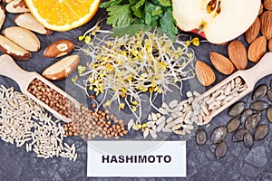 Inscription hashimoto with products and ingredients containing vitamins for healthy thyroid