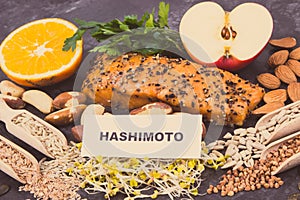 Inscription hashimoto with products and ingredients containing vitamins for healthy thyroid