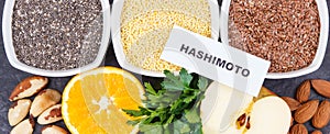 Inscription hashimoto with products and ingredients containing vitamins for healthy thyroid