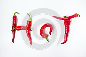 The inscription `hot` is composed of red hot peppers on a white background