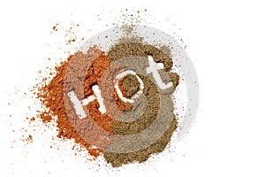 Inscription hot on a red ground paprika and black pepper, isolated on white background, top view