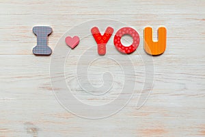 Inscription I love you written in wooden made letters on wood vintage background