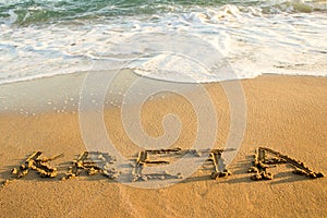 An inscription kreta  on the sand at the beach greece