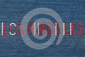 Inscription Los Angeles, inlaid rhinestones on denim.