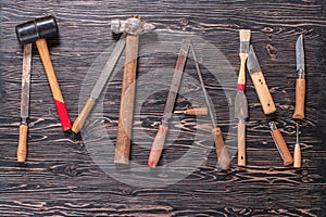 The inscription MAN is written by work tools. The word MAN is made up of a work tools