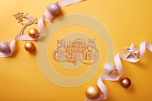 The inscription merry christmas displayed in the middle of yellow background