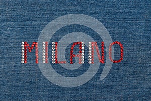 Inscription Milano, inlaid rhinestones on denim.