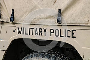 Inscription of military police on the side of a army cargo supply truck