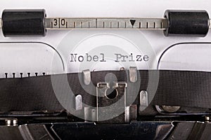 The inscription "nobel prize" on a white sheet in a typewriter. Nobel prize in literature