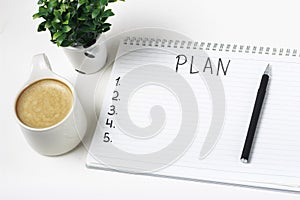 Inscription Plan in notepad, close-up, top view, concept of planning, goal setting