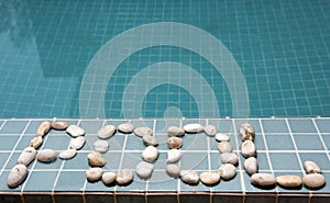 The inscription pool is laid out by pebble on a pool side