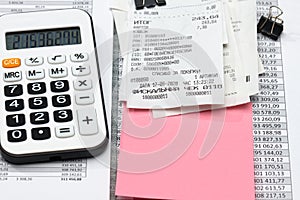 Inscription in Russian - fiscal receipt, calculator and financial reports, analysis and accounting, various office items for