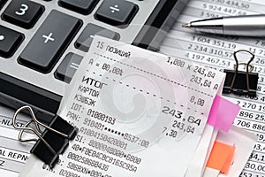 Inscription in Russian - fiscal receipt, calculator and financial reports, analysis and accounting, various office items for