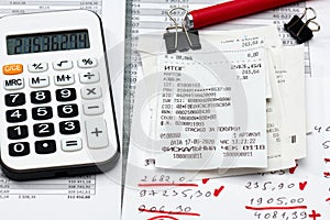 Inscription in Russian - fiscal receipt, calculator and financial reports, analysis and accounting, various office items for