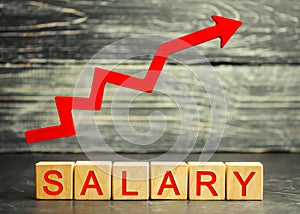 The inscription salary and the red arrow up. increase of salary, wage rates. promotion, career growth. raising the standard of photo