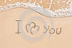 Inscription on sand I love you