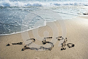 Inscription on the sand minus twenty-five percent, 25 %, the se
