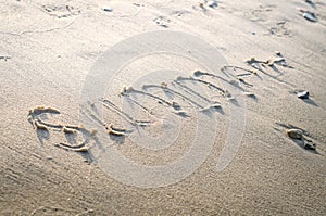 the inscription on beach sand