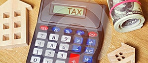 Inscription Tax on the calculator. The concept of paying taxes for the property. Liabilities or repayment of debt. Calculated photo