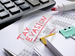 Inscription tax evasion on financial statements. photo