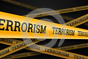 Inscription terrorism on a yellow barrage on a black background. The concept of stop terror, terrorist attack, explosions,
