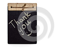 The inscription thank you is written in chalk on a black board on a white background