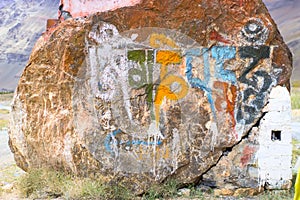 Inscription from Tibetan symbols on a stone.
