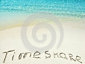 Inscription Timeshare in the sand on a tropical island, Maldives.