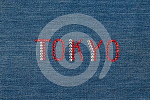 Inscription Tokyo, inlaid rhinestones on denim.