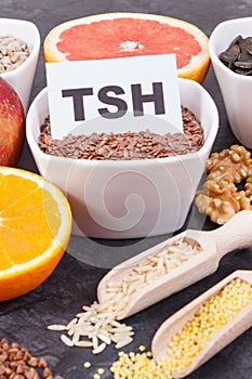 Inscription TSH with nutritious products and ingredients containing vitamins for healthy thyroid