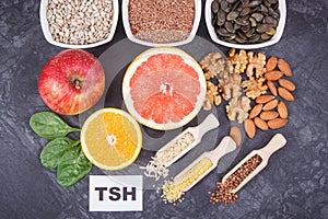 Inscription TSH with nutritious products and ingredients containing vitamins for healthy thyroid