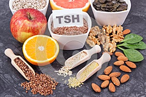 Inscription TSH with nutritious products and ingredients containing vitamins for healthy thyroid