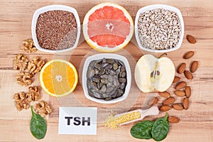 Inscription TSH with Products and ingredients containing vitamins for healthy thyroid
