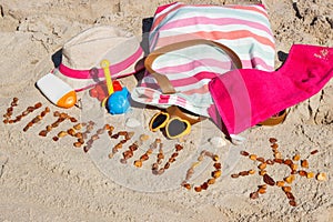 Inscription vitamin D, accessories for relax and childrens playing on sand at beach. Prevention of vitamin D deficiency