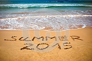 Inscription on wet sand Summer 2015. Concept photo of summer vacation