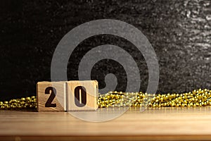 The inscription on the wooden blocks is 20. New year`s design