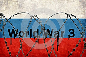 Inscription World War 3 on the background of the Russian flag behind barbed wire