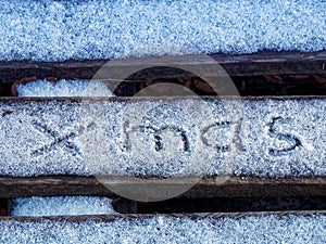 The inscription xmas on the snow. Beautiful christmas background.