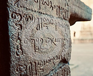 Inscriptions of Tamil language carved on the stone walls at Brihadeeswarar temple in Thanjavur, Tamilnadu, India.