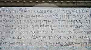 Inscriptions of Tamil language carved on the stone walls at Brihadeeswarar temple in Thanjavur, Tamilnadu, India.