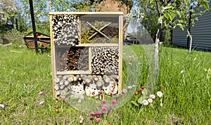 The insect house  or bugs hostel is in the garden. Ecological methods of pest control. Ideas for summer activities for children on