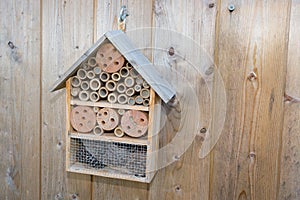Insect house in summer garden Hotel for insects in wood background