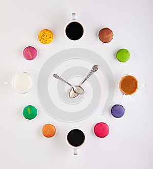 An insect themed clock ornament with colorful circles on a white background