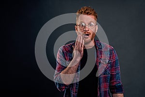 Insecure cute redhead man in glasses did not expact kiss in cheek from loving woman on date, touching face and staring