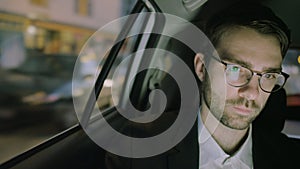 Insentient Young Businessman Sitting in the Car