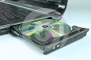 Insert a CD into the laptop